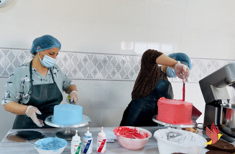 Yezidi female staff preparing pre-ordered cakes for Sugar is Sweet bakery